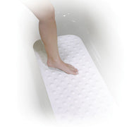 Person using a white bath mat with a textured pattern on a white background
