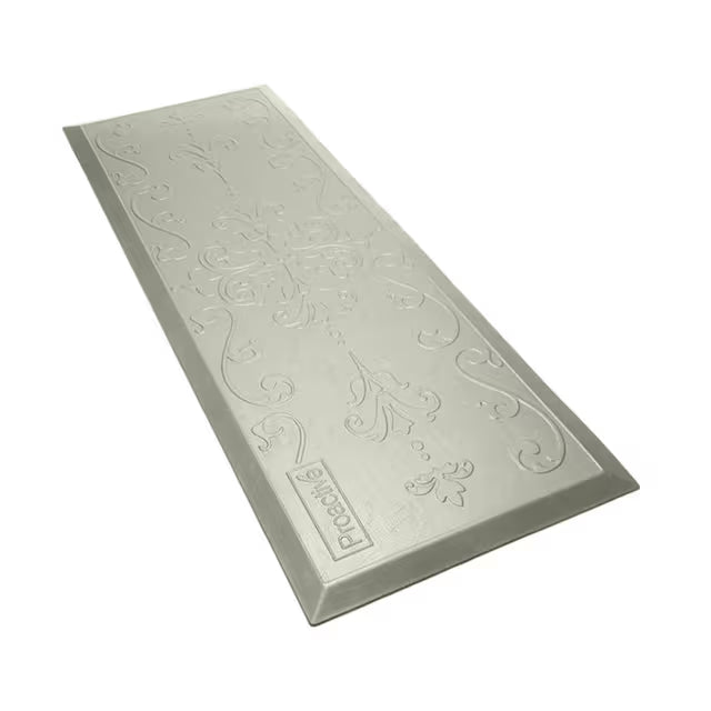 A rectangular gray textured mat with embossed floral and scroll patterns, featuring a small 'PROBEK' brand label near one corner, shown on a plain white background.