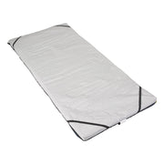 White sleeping bag with black zipper on a white background