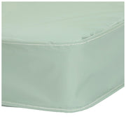 Light green fitted sheet corner on a white background