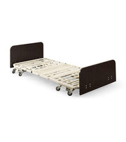 Bed frame with wooden head and footboards on a white background