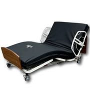 A hospital-style adjustable bed with a black fitted sheet and mattress cover, shown on a white background. The bed frame is white metal with wood-toned head and foot boards, and casters are visible at the base.