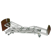 Hospital bed with wooden head and footboards on a white background