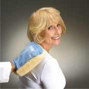 Woman wearing a blue and yellow heating pad on her shoulder against a gray background