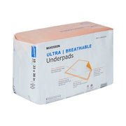 Box of McKesson ultra breathable underpads on a white background