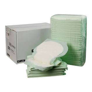 Stack of green disposable pads with a box in the background