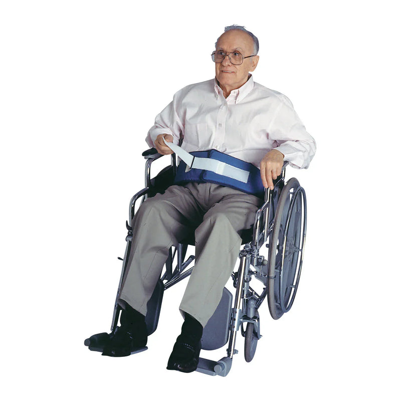 Man in a wheelchair with a safety belt on a white background
