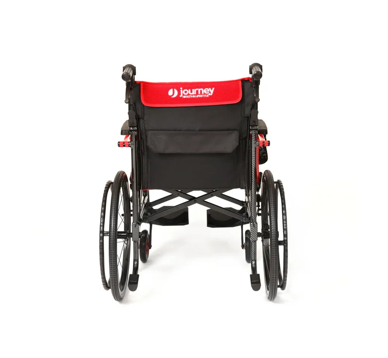 Black wheelchair with red seat cover on a white background