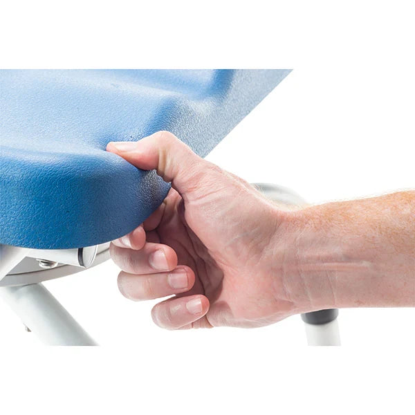 Hand holding a blue chair seat cover against a white background