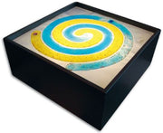 Decorative box with a colorful spiral design on a white background