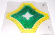 Hexagonal object with green center and yellow border on a white background