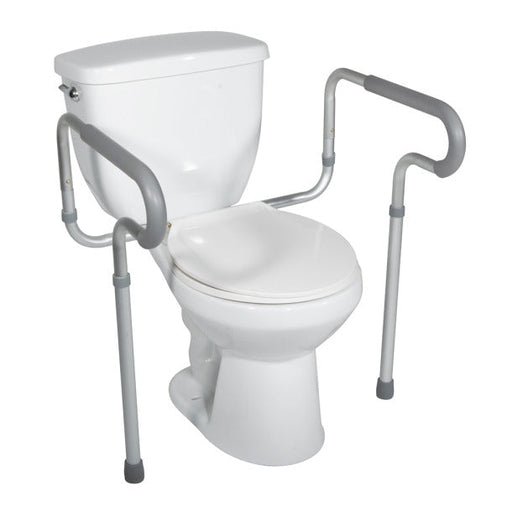 White toilet with a safety frame and handle on a white background