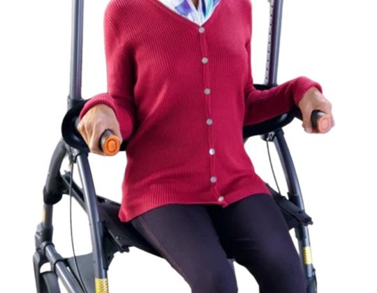 Person using a walker with a red sweater on a white background